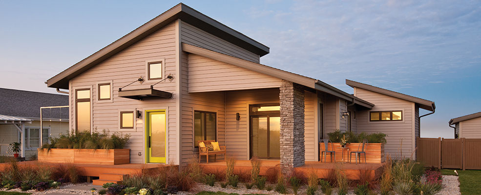 A modern Minnesota home with windows, roofing, and Mastic Lap siding by Minnesota Restoration Contractors.