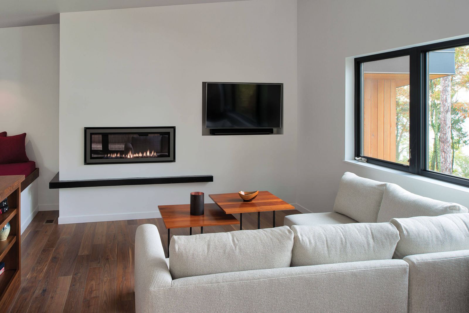 A modern living room with black ultimate case frames.