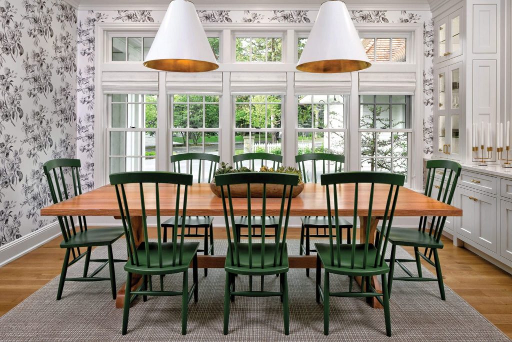 The dining room in a traditional Southern colonial home features Marvin Ultimate Double Hung Insert G2 Signature Collection available for purchase and installation at MNRC Inc.