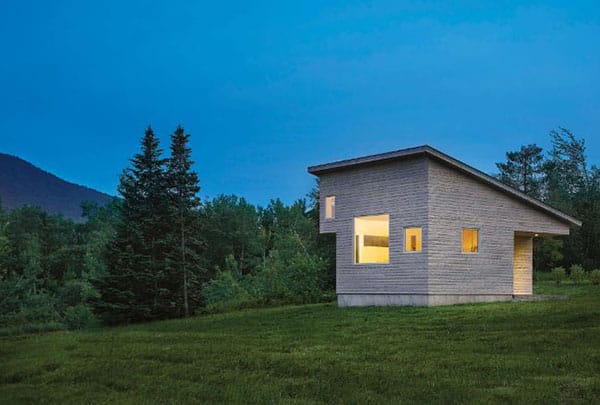 A modern Minnesota cabin with windows, roofing, and siding by Minnesota Restoration Contractors.